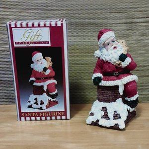 Vintage painted Ceramic Santa Figurine Carrying Sack of Toys Down Chimney (tan)